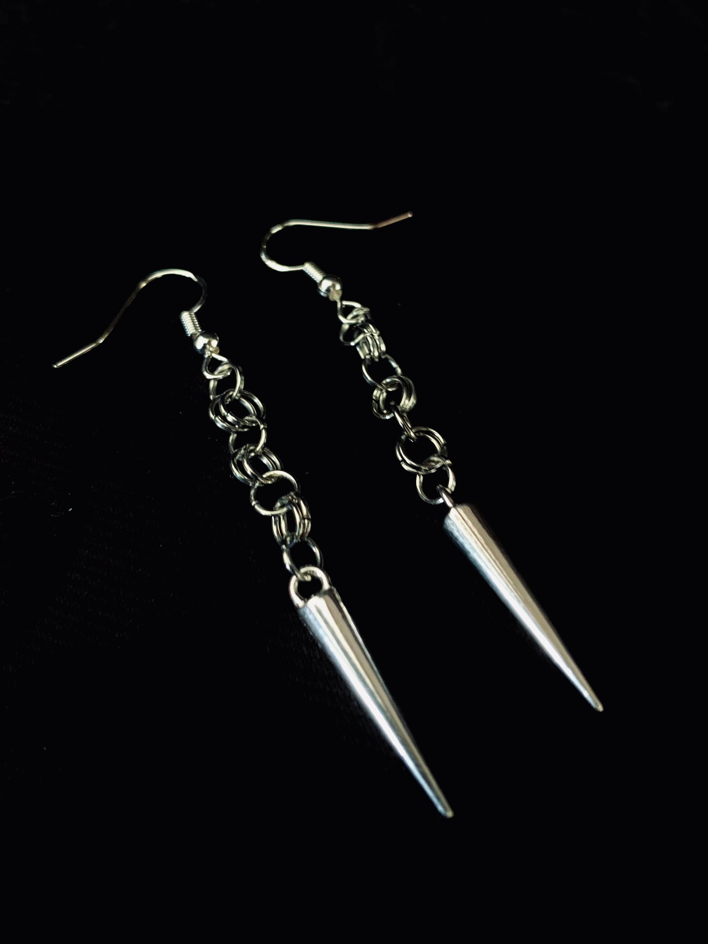 Steel maid spiked earrings