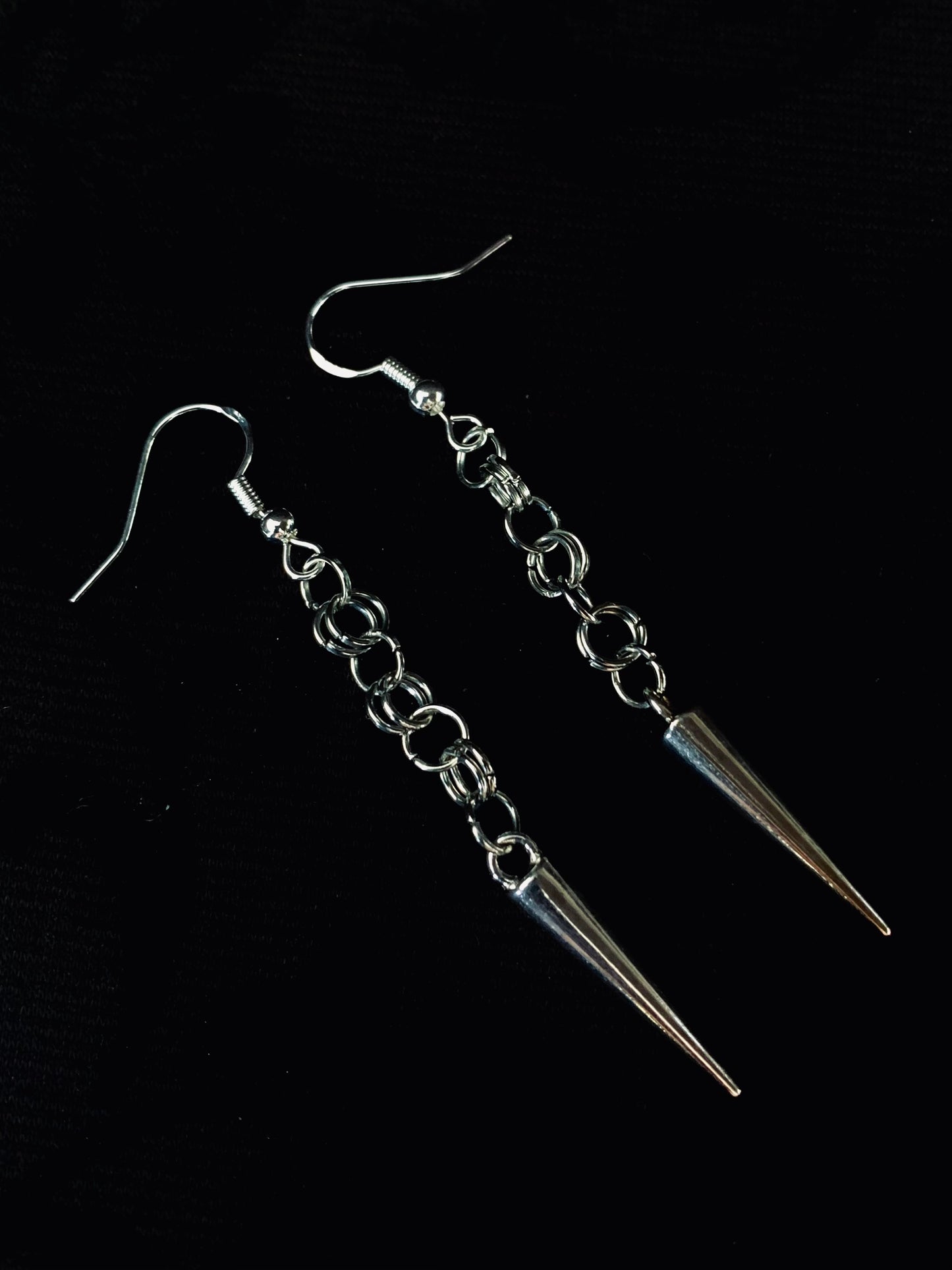 Steel maid spiked earrings