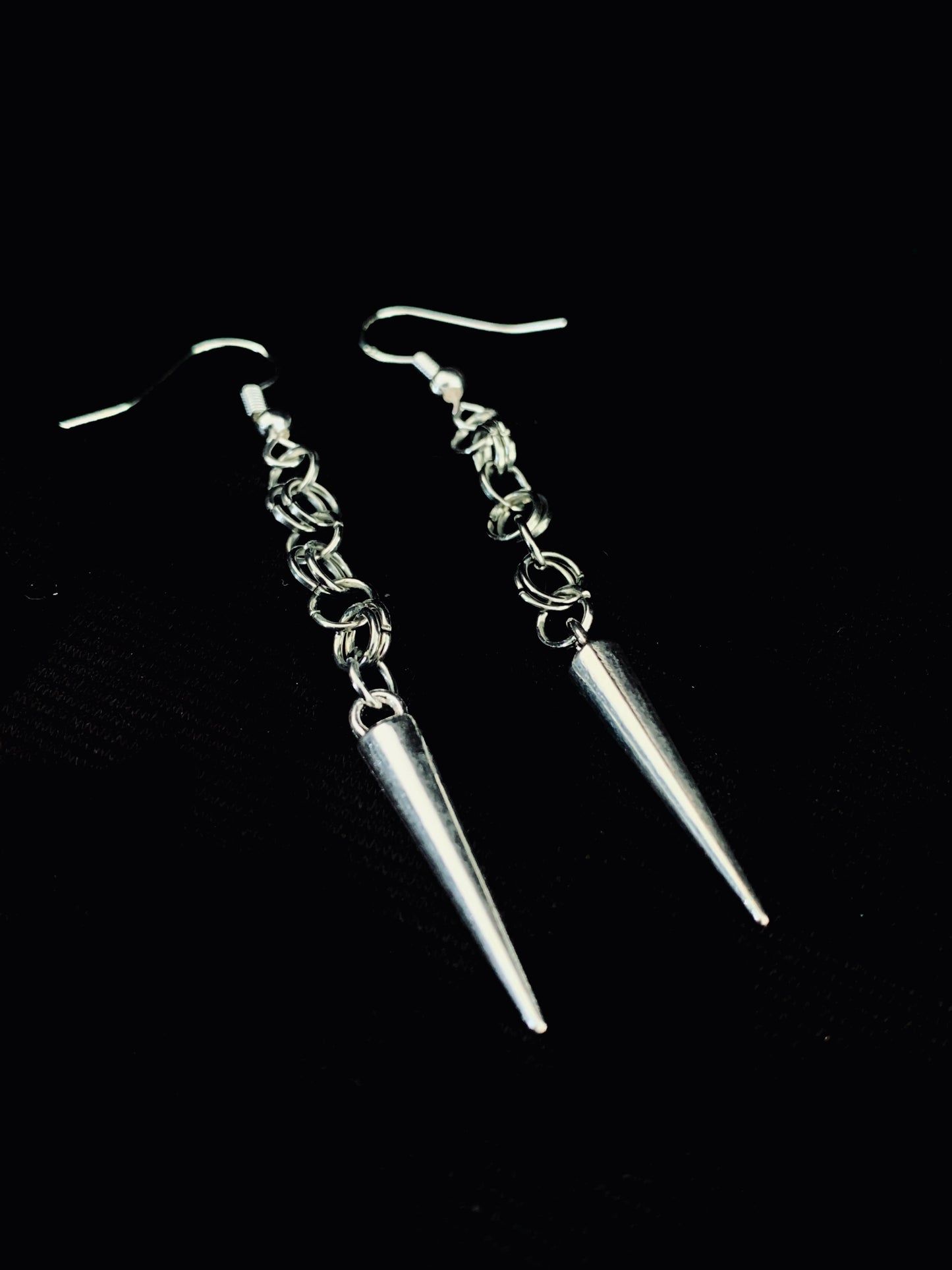 Steel maid spiked earrings